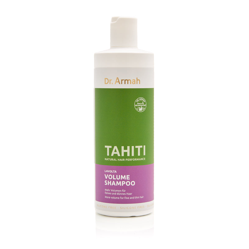 Ein professionelles Produktfoto einer Flasche "Dr. Armah TAHITI Volume Shampoo" vor einem weißen Hintergrund. Die zylindrische Flasche hat ein dreifarbiges Design in Weiß, Grün und Lila und trägt weiße und goldene Schrift.