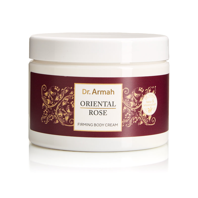 Ein weißer Tiegel der Dr. Armah Oriental Rose Firming Body Cream mit einem weinroten und goldenen Etikett, fotografiert vor einem weißen Hintergrund.