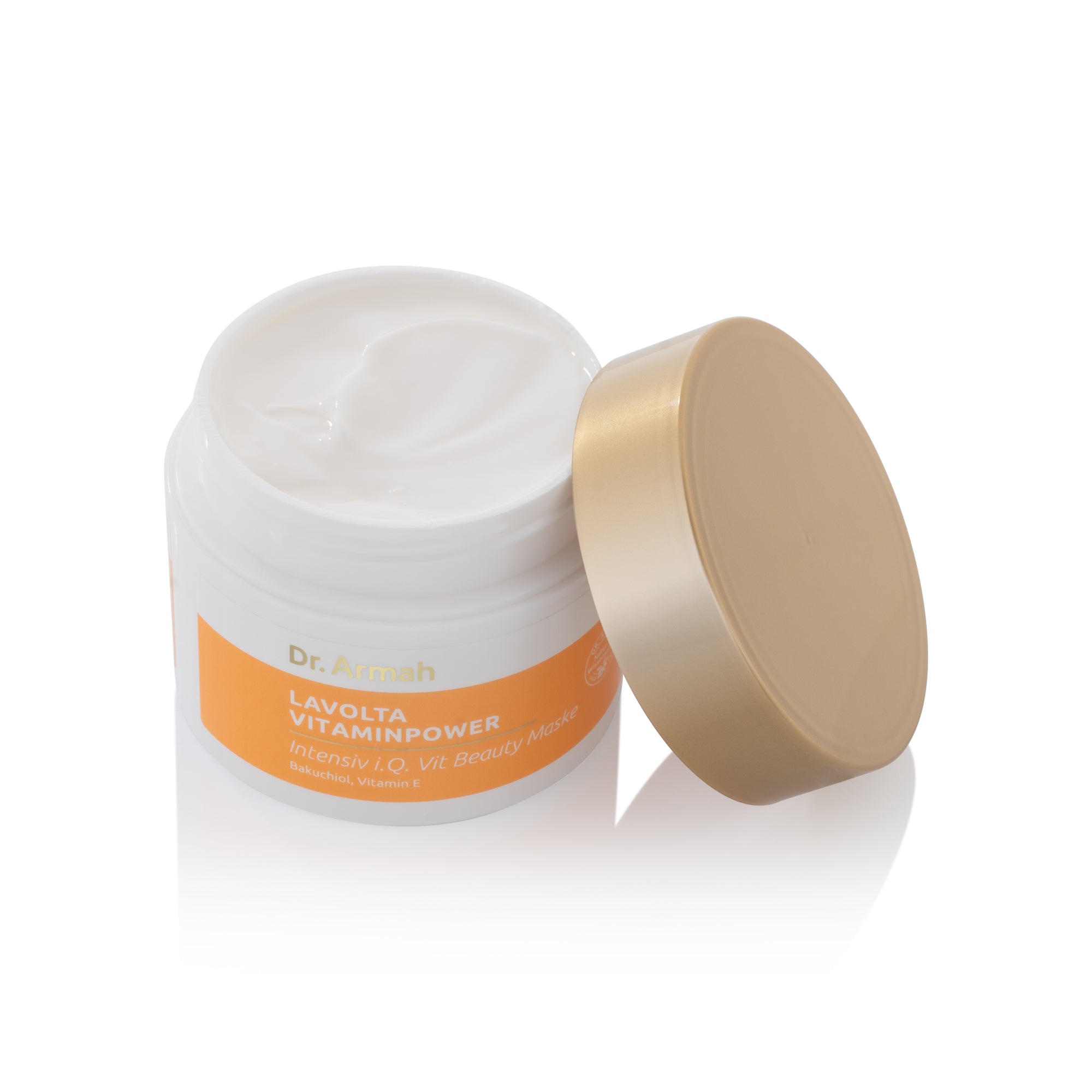 Geöffnete Dose der Dr. Armah Lavolta Vitaminpower Intensiv i.Q. Vit Beauty Maske, die die weiße, cremige Textur der Maske zeigt, mit dem goldfarbenen Deckel daneben auf weißem Untergrund.